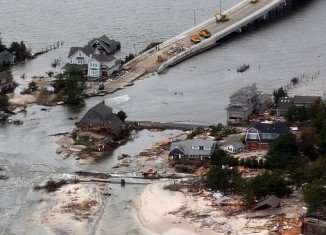 Ed Wright's house was surrounded on all sides by water after Superstorm Sandy breached the protective sand dunes in his community