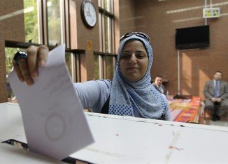 Egyptians have begun voting on a new constitution endorsed by the Islamist president Mohamed Morsi, which has divided the country and sparked deadly unrest