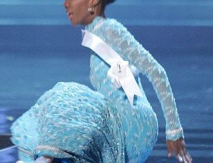 Miss Guyana Ruqayyah Boyer became a fashion victim of her floor-sweeping evening dress and crashed to the floor in front of the judges at Miss Universe 2012 in Las Vegas