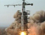 North Korea has announced an apparently successful launch of a long-range rocket defying international warnings