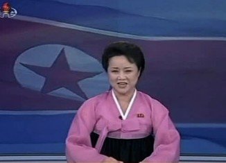 North Korean animated female anchor appears exhilarated as she describes the rocket launch, which was reported by state media as the successful positioning of a weather satellite in space