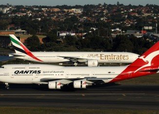 Qantas Airways has been given initial approval from Australia's competition authority for its proposed alliance with Dubai-based Emirates