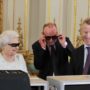 Queen Elizabeth wearing 3D glasses as she gets a sneak preview of 2012 Christmas Day message