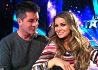 Simon Cowell has confirmed he is dating TV presenter and model Carmen Electra