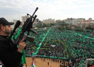 Tens of thousands of people have gathered to attend a rally in the Gaza Strip to mark the 25th anniversary of the Palestinian Islamist group Hamas