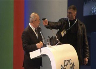 A man put a gun to the head of Ahmed Dogan, the leader of Bulgaria's ethnic Turkish party, during a televised conference in Sofia