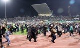 An Egyptian court has sentenced to death 21 defendants over clashes between rival football fans at Port Said stadium in which 74 people were killed last February
