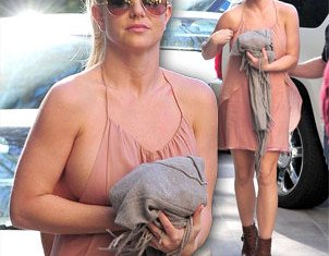 Britney Spears came pretty close to losing part of her dress on her way to lunch on Saturday afternoon