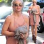 Britney Spears wardrobe malfunction: singer reveals side cleavage in pink halter dress