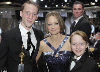 Jodie Foster plans to tell her beloved sons who their father is when they turn 21, the mother of the star's best friend claimed today