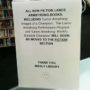 Lance Armstrong Manly library sign promises to move his non-fiction book to fiction section