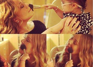 Mariah Carey uploaded an adorable set of photos of her 20-month-old daughter Monroe applying powder to her famous mother's face
