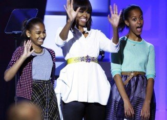 Michelle Obama paraded her new haircut as she took the stage with her daughters at Kids' Inaugural Concert