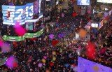 Revelers in Times Square welcomed in 2013 with a spectacular display of fireworks and confetti as they watched the famous Waterford crystal ball make its annual descent to mark the New Year