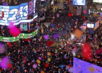 Revelers in Times Square welcomed in 2013 with a spectacular display of fireworks and confetti as they watched the famous Waterford crystal ball make its annual descent to mark the New Year