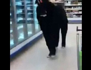 Two pranksters dressed up as a pantomime horse were thrown out of a UK Tesco supermarket after trotting around the frozen beef burger aisle