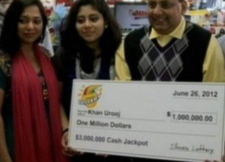 Urooj Khan pictured with wife Shabana Ansari, daughter Jasmeen and his $1 million winnings shortly before his death from cyanide poisoning
