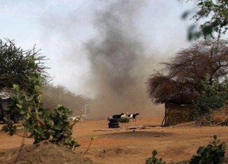 A heavy gunfire is being exchanged between Malian troops and suspected Islamist militants on the streets of Gao in northern Mali