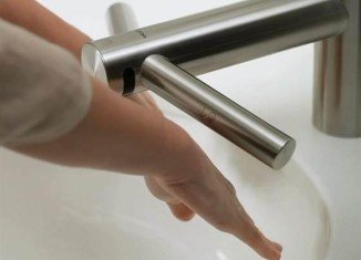 Dyson has unveiled Airblade Tap, a device that combines a high-speed hand dryer with hot and cold water outlets