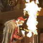Wesley Daniel’s head on fire as he tries to breathe flames at the Lyric Opera of Chicago