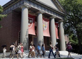 Harvard University has imposed academic sanctions on dozens of students for cheating in a final exam