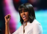 Michelle Obama jokingly says a mid-life crisis is what inspired her new haircut with bangs