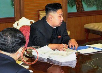 North Korean leader Kim Jong-un has been photographed with a smartphone beside him during a meeting