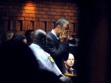 Oscar Pistorius carried his dying girlfriend Reeva Steenkamp downstairs and tried to resuscitate her as he desperately attempted to save her life