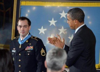 President Barack Obama has presented the Medal of Honor to former Staff Sgt Clinton Romesha for his heroism during a huge firefight in Afghanistan