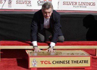 Robert De Niro is the latest Hollywood star who leaves his hand and footprints in cement outside the noted Chinese Theatre