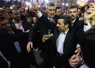 Security guards have seized a man who tried to hit Iran’s President Mahmoud Ahmadinejad with a shoe as he visited a mosque in the Egyptian capital Cairo