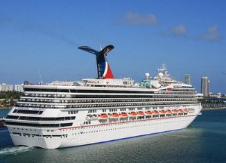 Stranded Carnival Triumph cruise ship with more than 4,000 people aboard is within sight of land four days after an engine fire knocked out the vessel's power