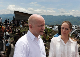 Angelina Jolie was spotted without her engagement ring as she arrived in the Democratic Republic of Congo and Rwanda with British Foreign Secretary William Hague