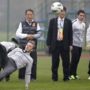 David Beckham slips over and lands on his backside in front of young Chinese footballers