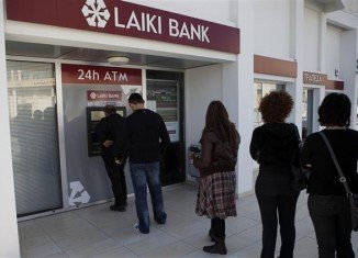 Many Cypriots, shocked that the bailout imposes a levy on bank deposits of up to 10 percent, were seen queuing to withdraw cash
