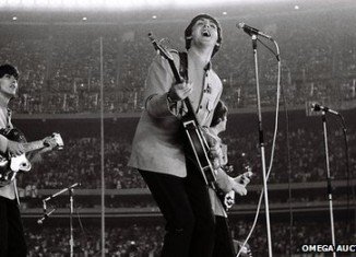 Rare pictures of The Beatles' 1965 Shea Stadium concert, taken by amateur photographer Marc Weinstein, who bluffed his way backstage, have sold for £30,000