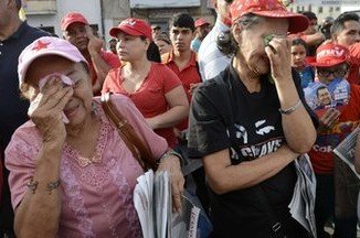 Thousands of Hugo Chavez's supporters took to the streets of Caracas to express their grief