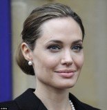 Angelina Jolie’s scraped back hairdo revealed her abundance of grey hairs as she made an appearance at the G8 Foreign Ministers Summit in London