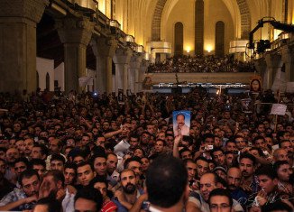 At least one person has been killed and more than 20 injured in clashes outside Cairo's St Mark's Cathedral following the funerals of four Coptic Christians killed in religious violence