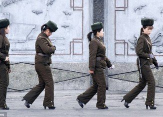 Images of four North Korean female soldiers in heels and Soviet-style hats were released in the latest act of bravado from dictator Kim Jong- un