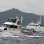 Japan warns China of using force over disputed islands landing
