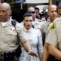 Kim Kardashian leaves LA court escorted by ten sheriffs as Kris Humphries faces fines for no-show