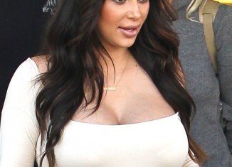 Kim Kardashian's bra size has gone up to F while she is concerned that she won't be able to lose the baby weight