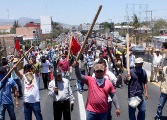 Mexican teachers incensed by sweeping education reforms have attacked the buildings of political parties in the south-western state of Guerrero