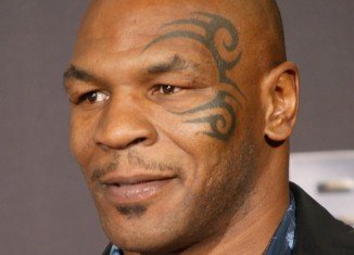 Mike Tyson tweeted on Monday that he was about to get laser treatment to have the ink removed