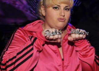 Rebel Wilson paid reverence to her Australian roots as she thrashed out a bizarre musical number to kick-off the 2013 MTV Movie Awards
