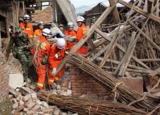 Rescue teams in China are struggling to reach survivors of 6.6-magnitude earthquake that killed 203 and injured some 11,500 in Sichuan province