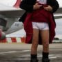 Richard Branson lifts his kilt to reveal pants bearing slogan as he promotes Virgin in Scotland