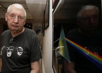 Storm Thorgerson designed the album cover showing a prism spreading a spectrum of color for Pink Floyd’s The Dark Side Of The Moon