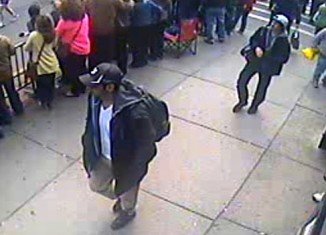 The FBI has released photos and video of two suspects they want to identify as part of the investigation into Monday's Boston Marathon bombings